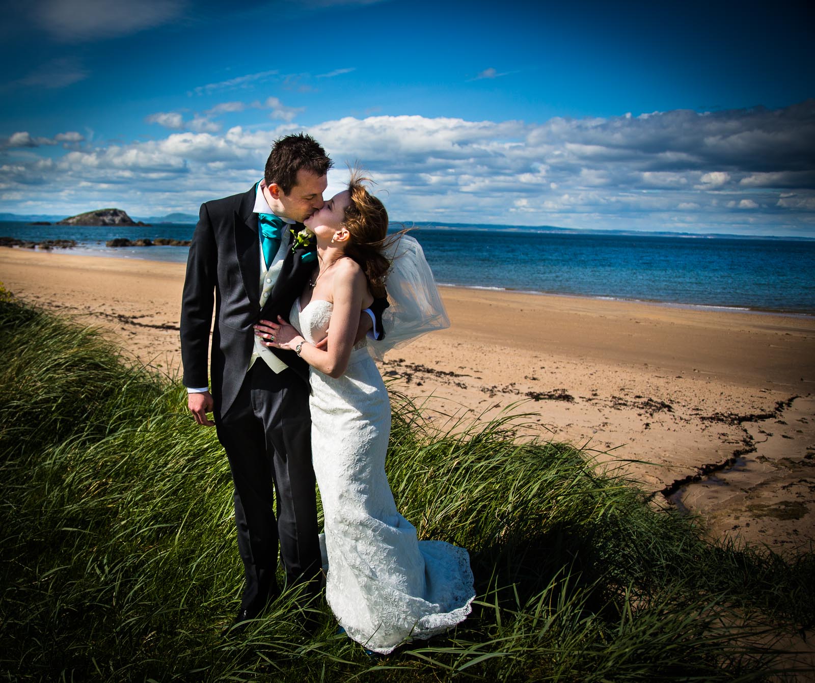 Bride and Groom kiss at the Beach