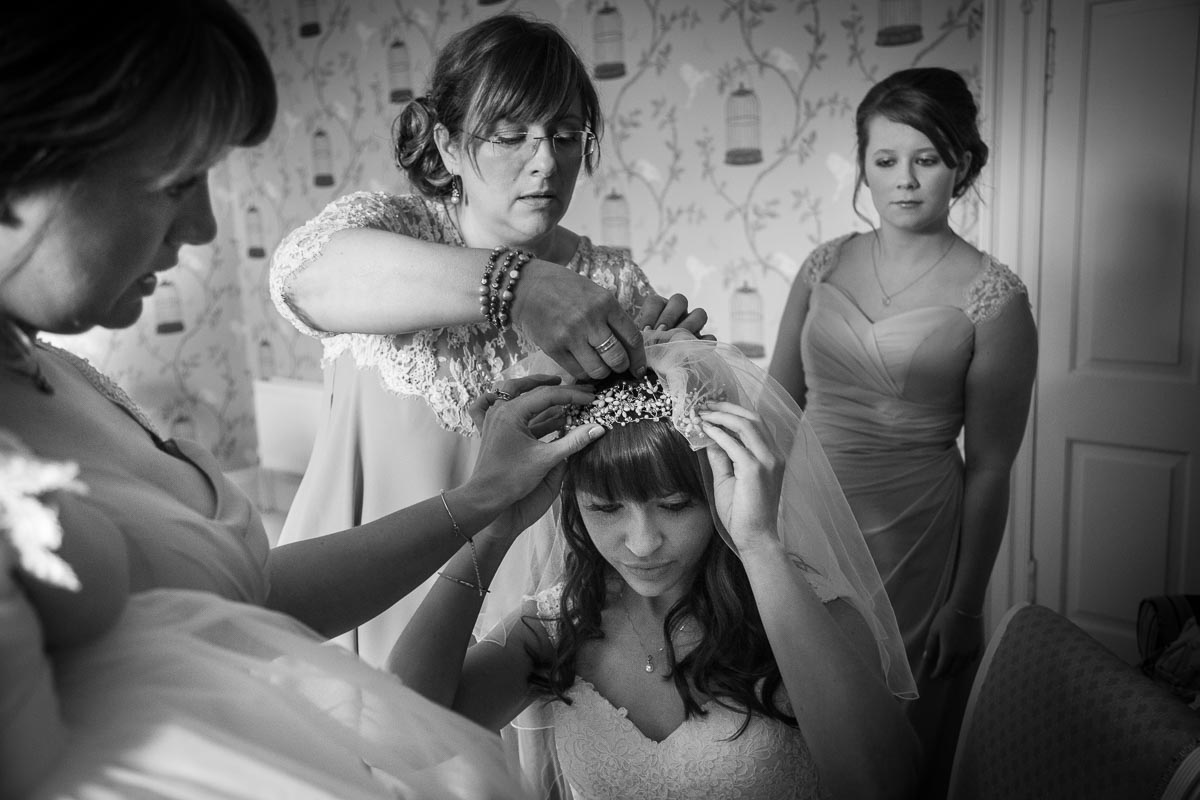 Mum fixing Bride's veil